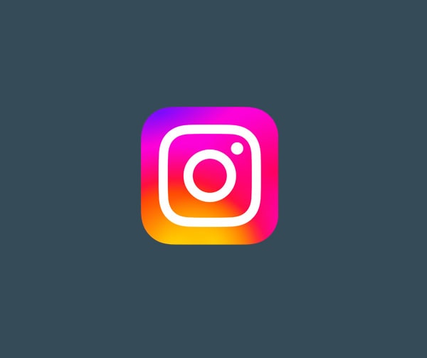 The Instagram app logo with a white camera outline on a purple, pink, and orange gradient background, centered on a dark gray backdrop.